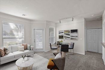 A living room with a couch and a table